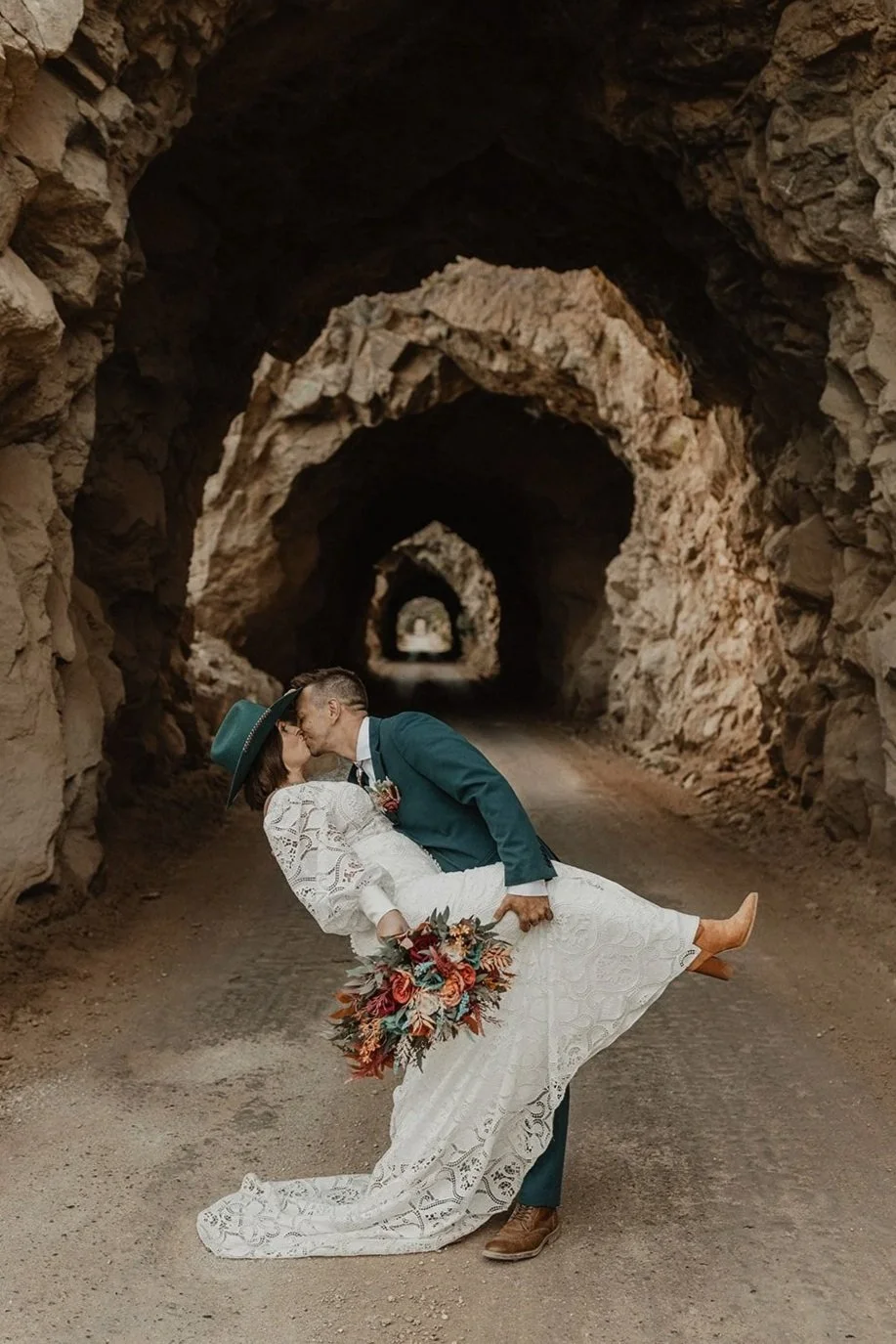 Silhouette elopement portraits inside the Midland Tunnels near Buena Vista Colorado