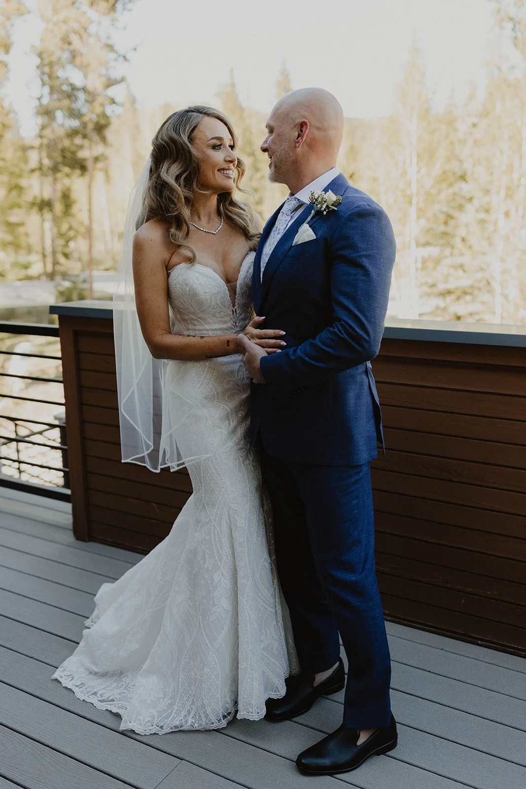 First look on cabin porch in Breckenridge Colorado before mountain elopement