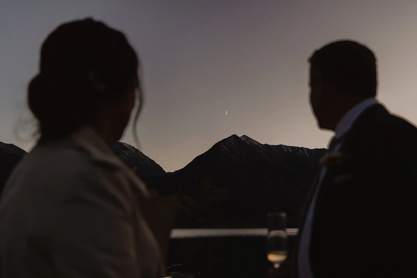 Crescent moon rising over Twin Lakes after Jill and Con’s Colorado elopement ceremony