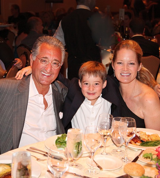 Del Bryant, son Thaddeus and wife Carolyn enjoy the Michael Bolton Charities and Dave Mason Benefit Concert and Celebrity Golf Classic. (Photo by Stuart Walls )