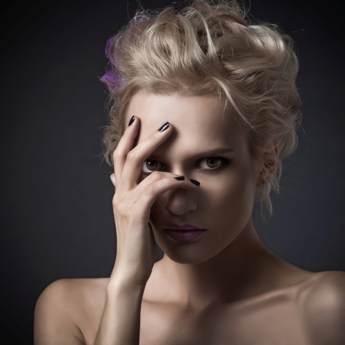 This woman is face-palming because she spent WAY TOO MUCH on biz tools she never used. 