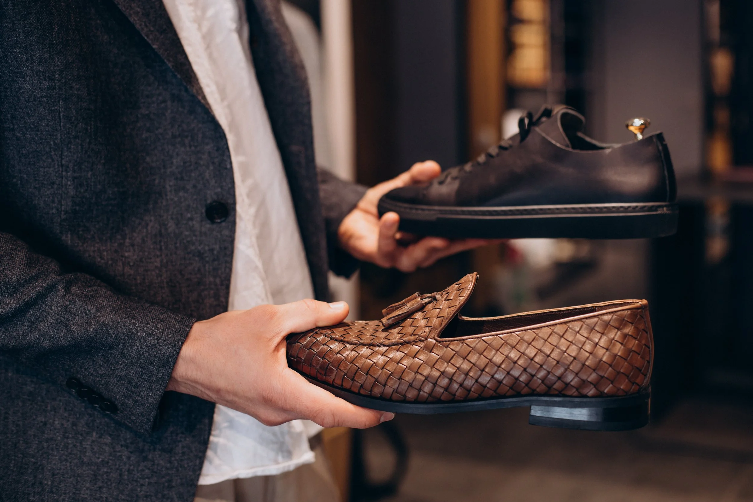man-choosing-foot-wear-mens-store.jpg
