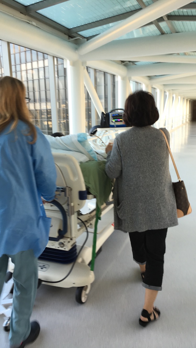 Mom Walking With Dad For Biopsy