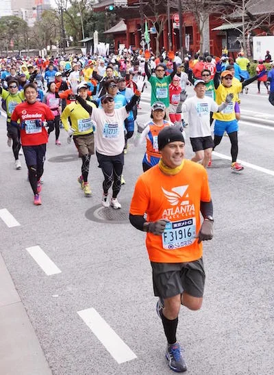 Photo of Michael running Tokyo Maration. Used as cover of Atlanta Track Club magazine, "Wingfoot". Follow Michael on Twitter .