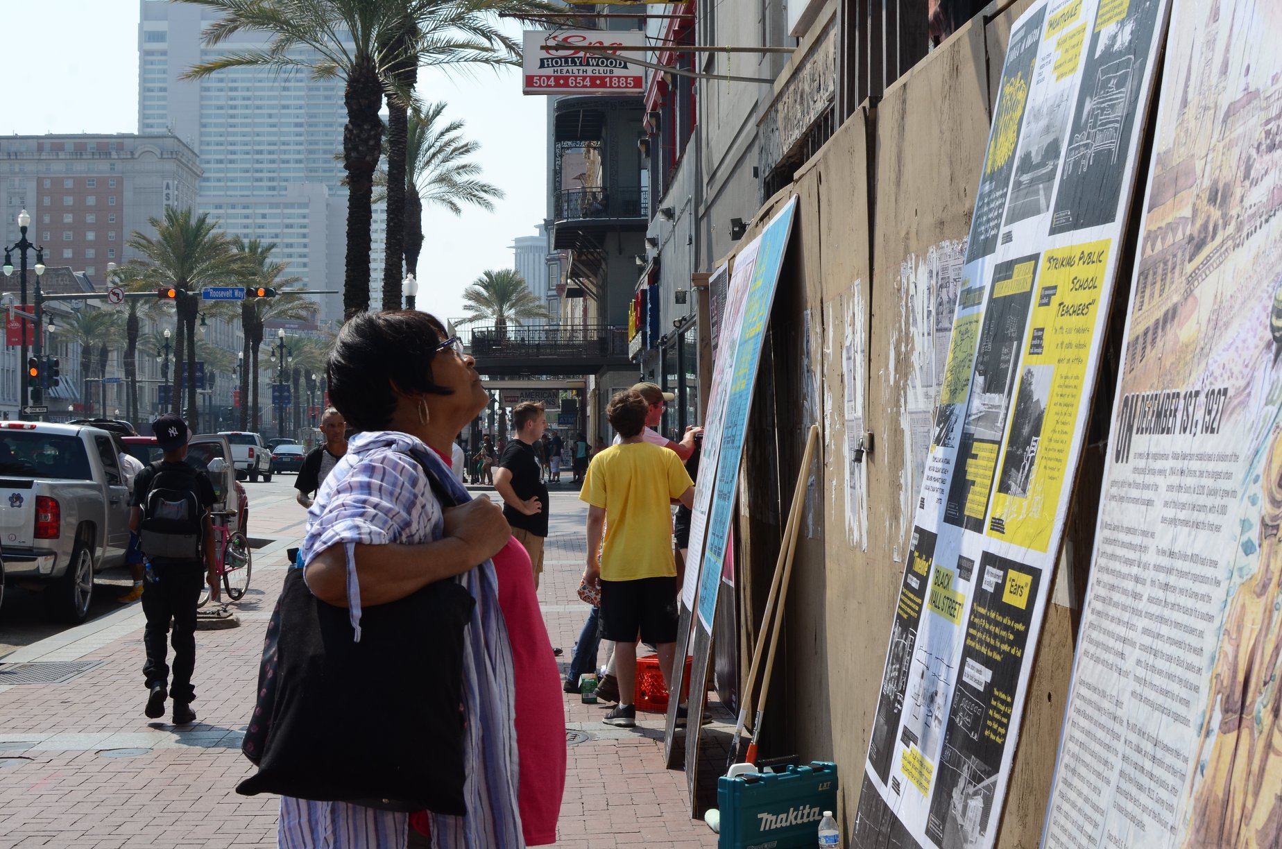 Installing Posters at Canal Street