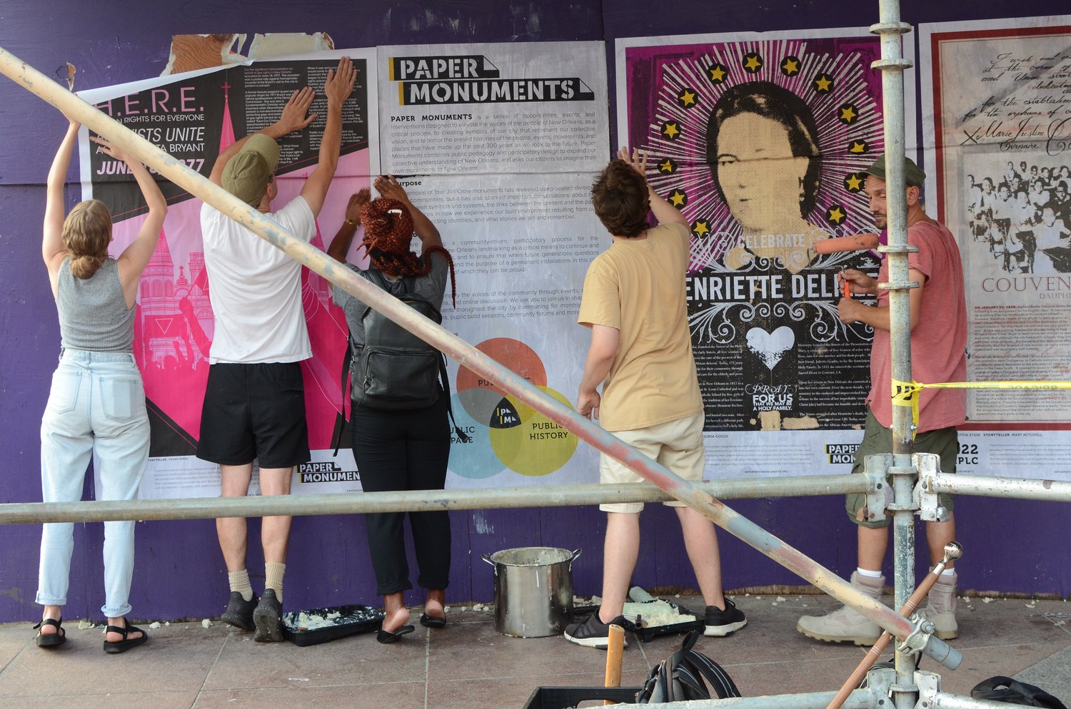 Installing Posters at Rampart Street