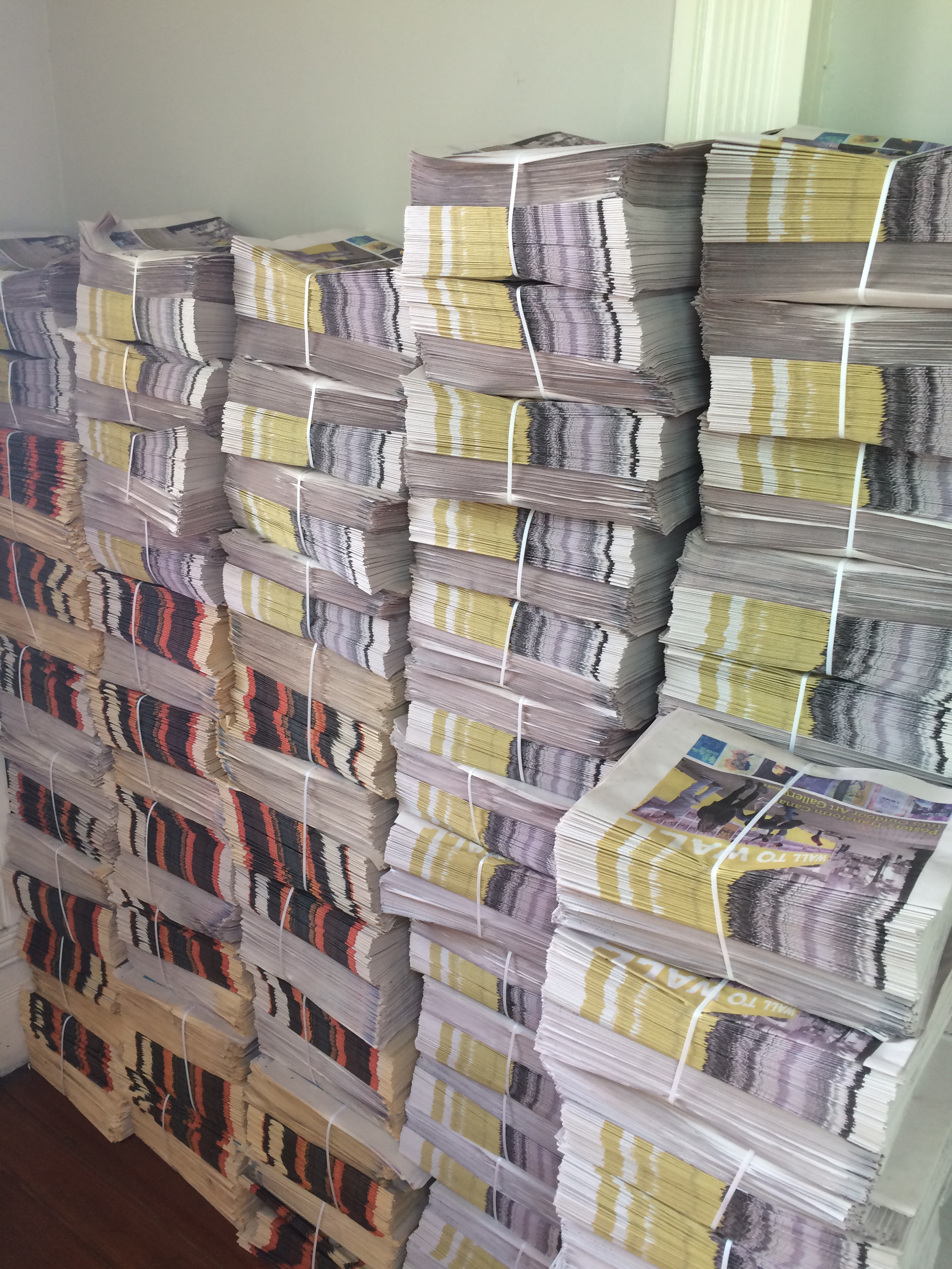 Stacks of the Paper Trail waiting to be distributed
