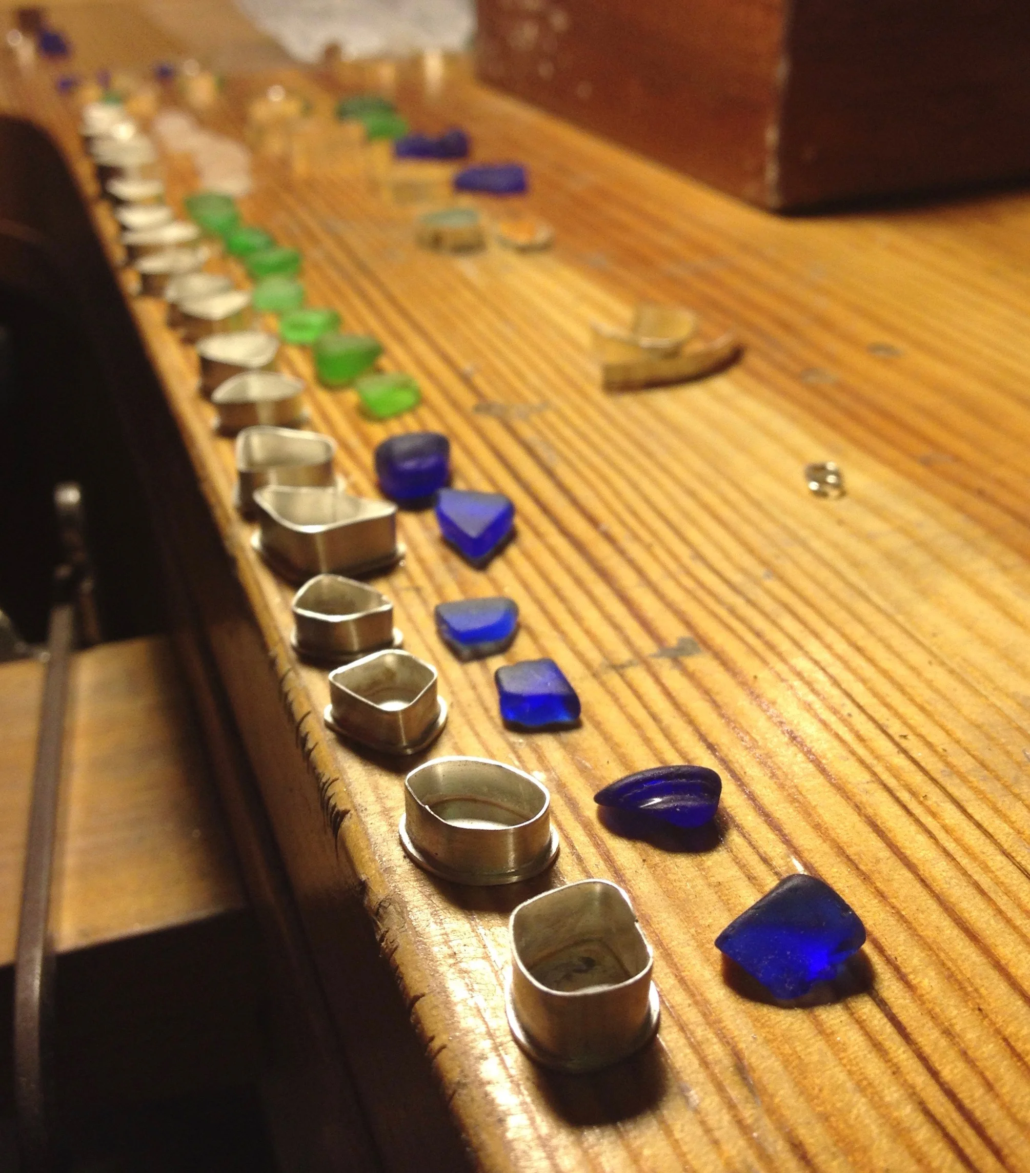 Sea glass settings ready for jump ring soldering.