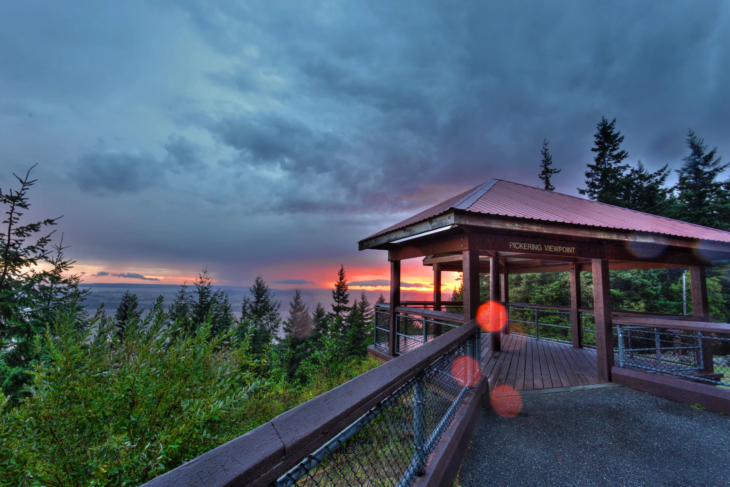 Pickering Viewpoint faces south across the farmlands of the Skagit River delta and over the towns of Conway and Laconner, Central Puget Sound, Camano & Whidbey Islands, all backdropped by the Olympic Mountains in the distance to the southwest. Photo © Peter Wheeler