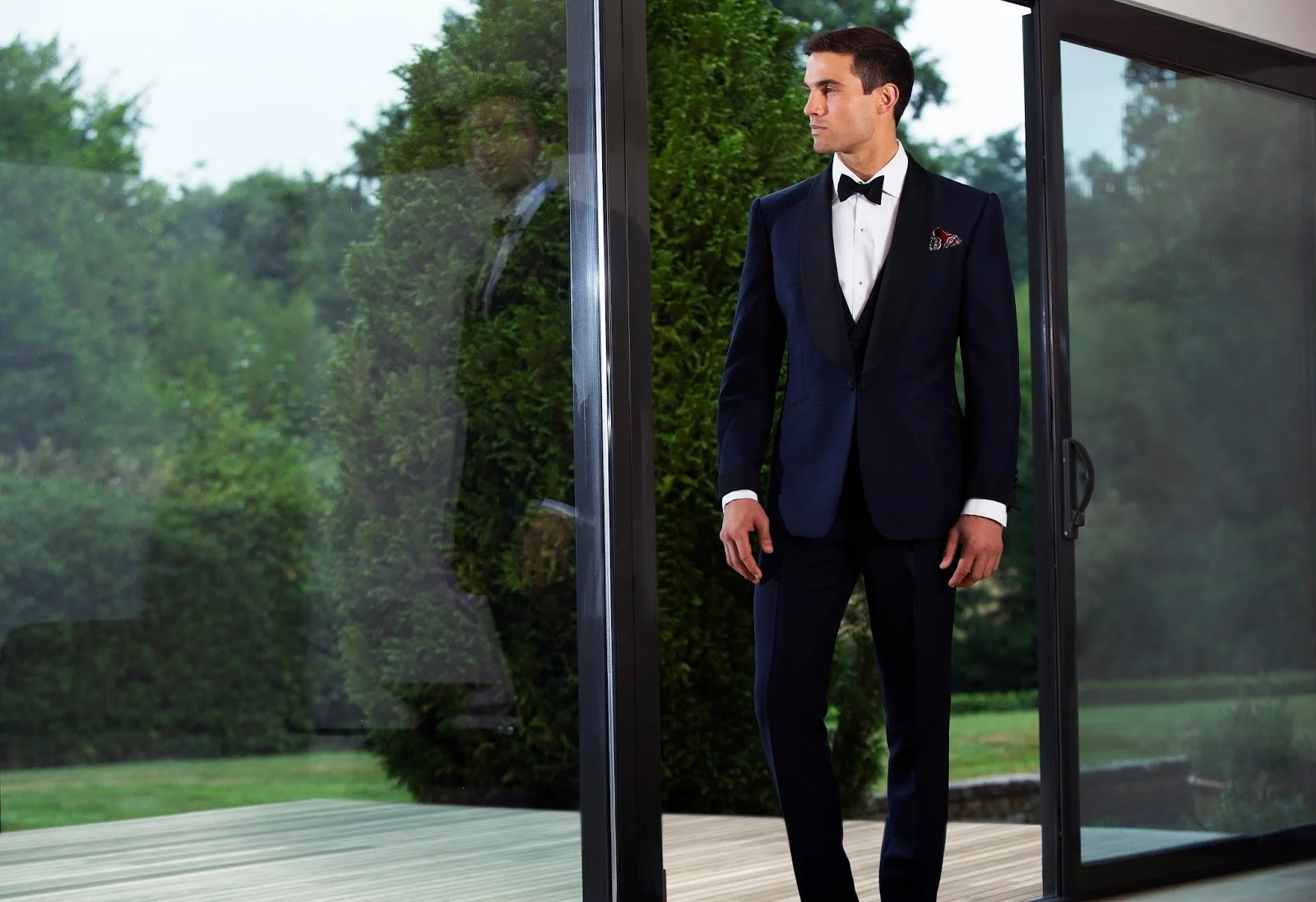 A formal look from Chester Barrie's current collection — debonair pocket square deployed with “reckless abandon.”
