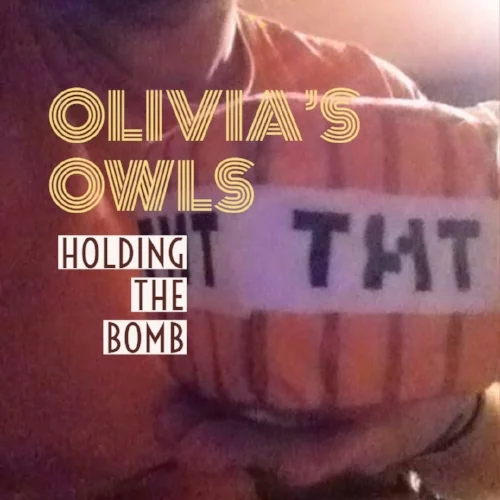 holding the bomb cover.jpg