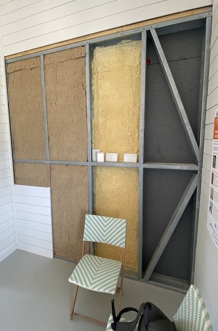  Hempitecture's HempWool thermal insulation (left two columns) is visible in the wall cut-out in Cypress CDC's accessory dwelling unit at the 2023 Innovative Housing Showcase in Washington, D.C., June 10, 2023.&nbsp;  Photo by Michael Sirak  