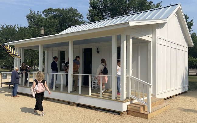  The 540-square-foot accessory dwelling unit, shown here on June 9, 2023, that Cypress CDC erected on the National Mall for the 2023 Innovative Housing Showcase. The structure contained Hempitecture's HempWool thermal insulation.  Photo by Michael Si