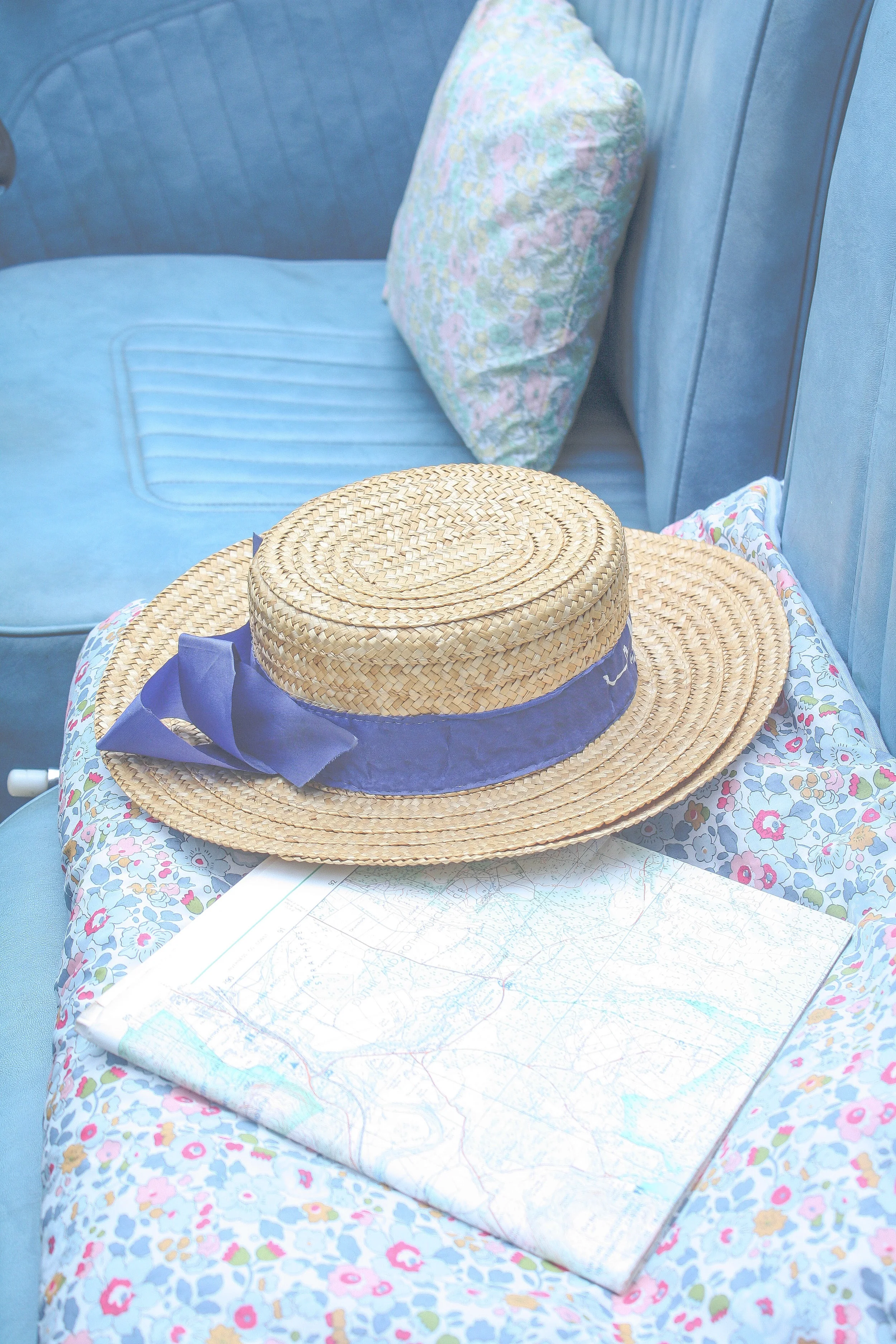 Obviously the best kind of travel is in Morris Minor with Liberty print cushions and a dashing gentleman