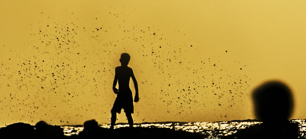 (ts1170) boy on the beach with water splashes.jpg