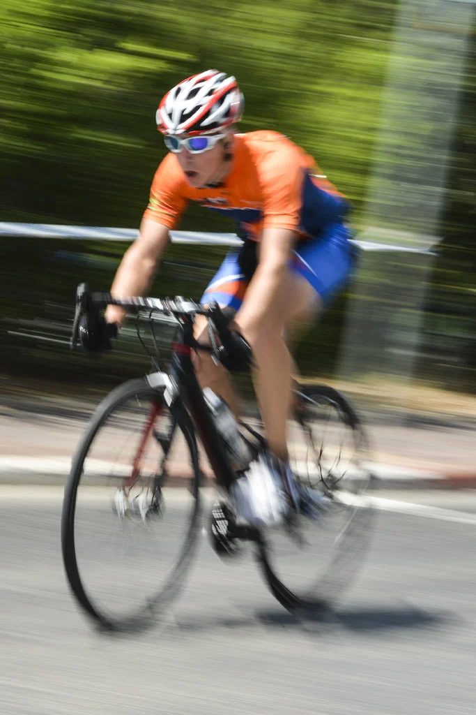 (ts1194) bicycle rider with orange shirt in motion.jpg