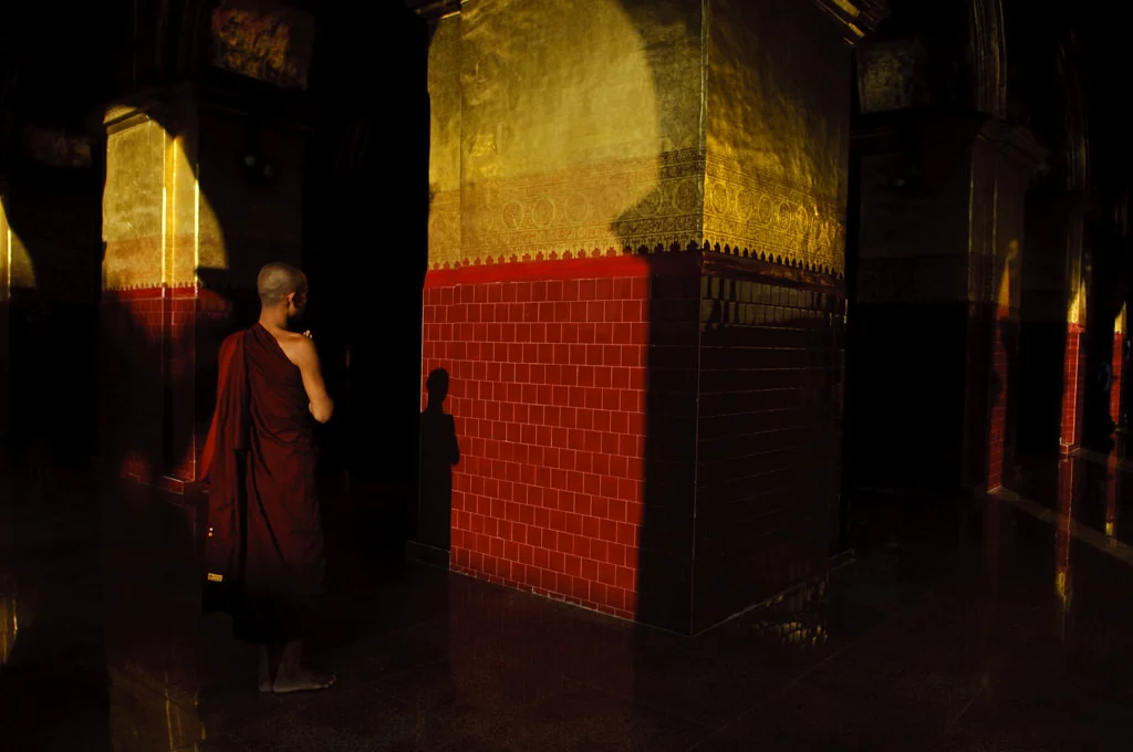 (201) a monk praying in a temple, mandalay, myanmar (burma).jpg