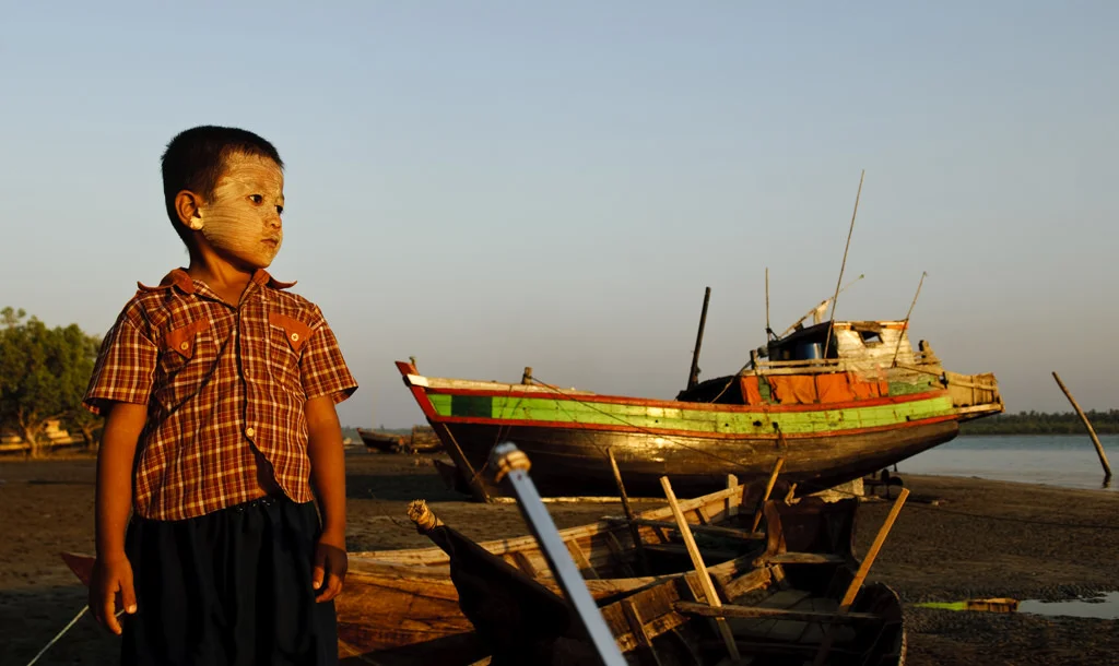 (202) a boy standing by a stranded ship, chaung tha beach, myanmar (burma).jpg