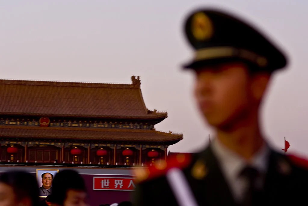 (211) a soldier with mao in the background, tiananmen square, beijing, china.jpg