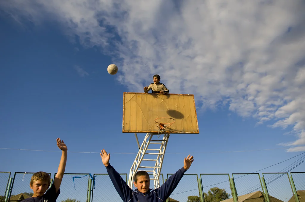 (144) boys raising hands in a basketball court, gori, georgia.jpg