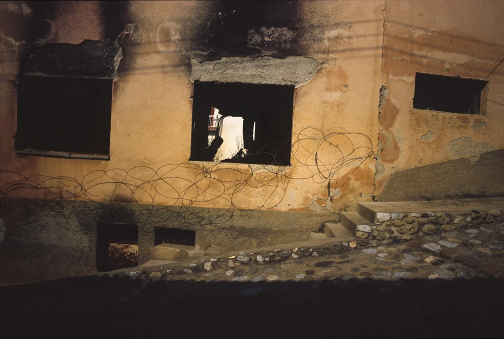 (ts207) a burned house with wire in prizren kosovo.jpg