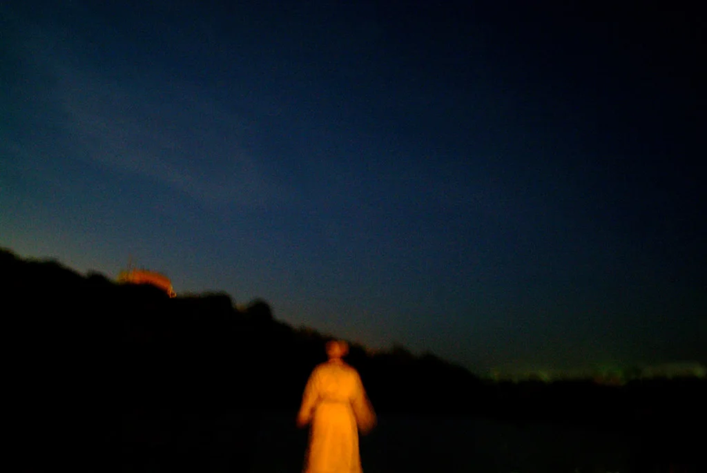 (122) an orthodox jew prays by a lake at night, uman, ukraine.jpg