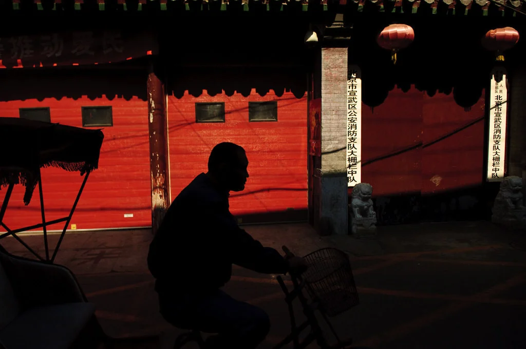 (199) a man with bike passes by, beijing, china.jpg