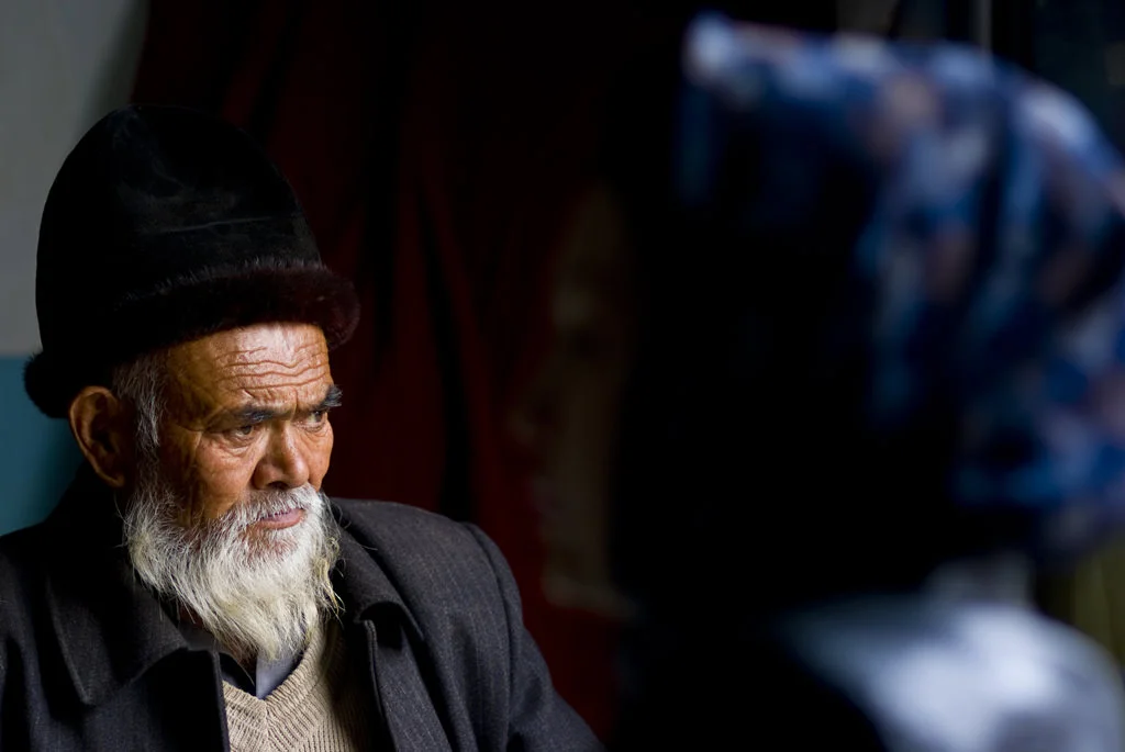 (212) an older Uyghur man looking outside, kashgar, china.jpg