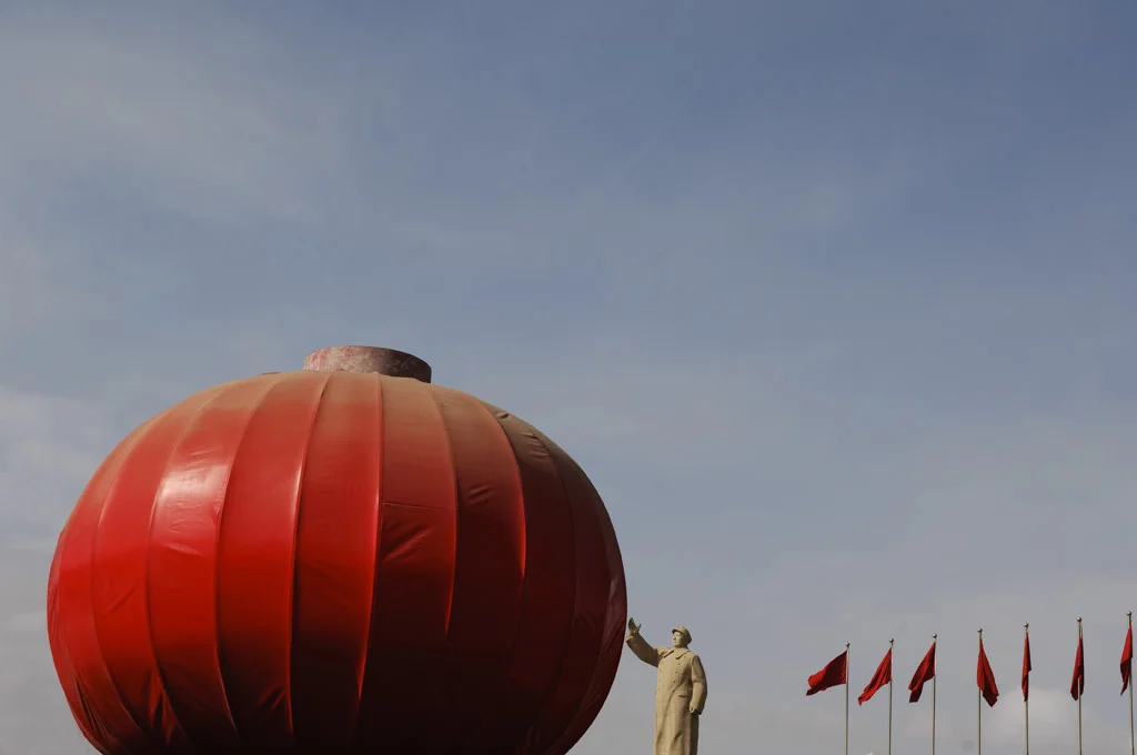 (218) a mao statue with a giant pommegranat, kashgar, china.jpg