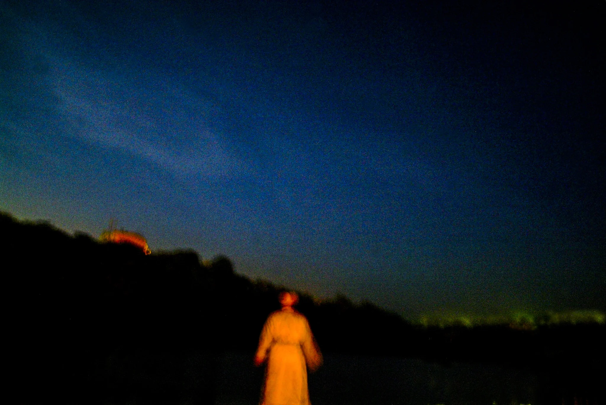 (122) an orthodox jew prays by a lake at night, uman, ukraine.jpg