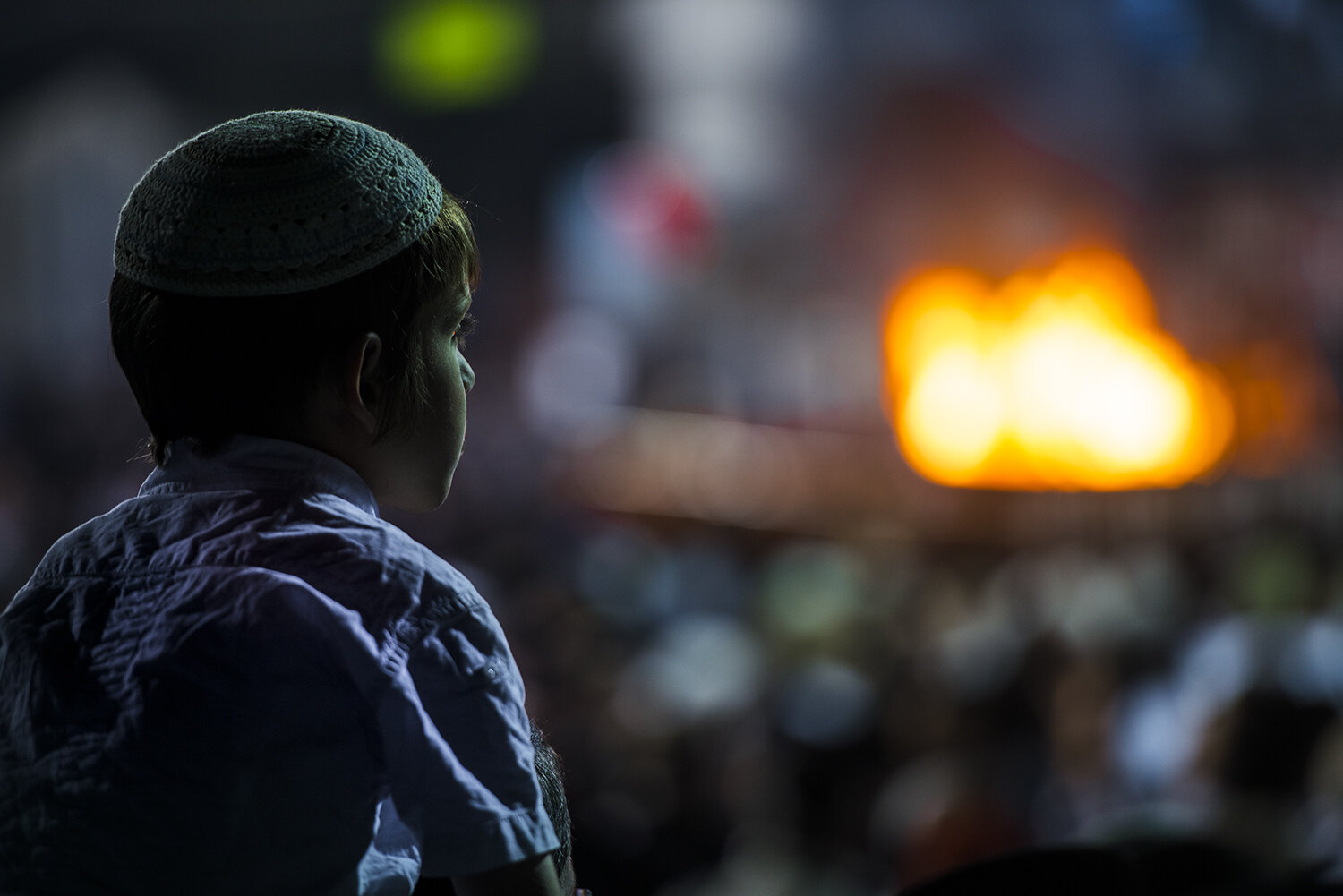 boy in meron with bonfire israel.jpg