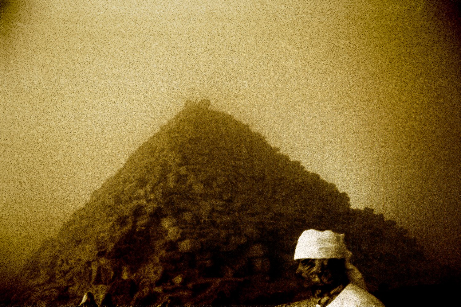 a man in white infront of a pyramid, egypt.jpg
