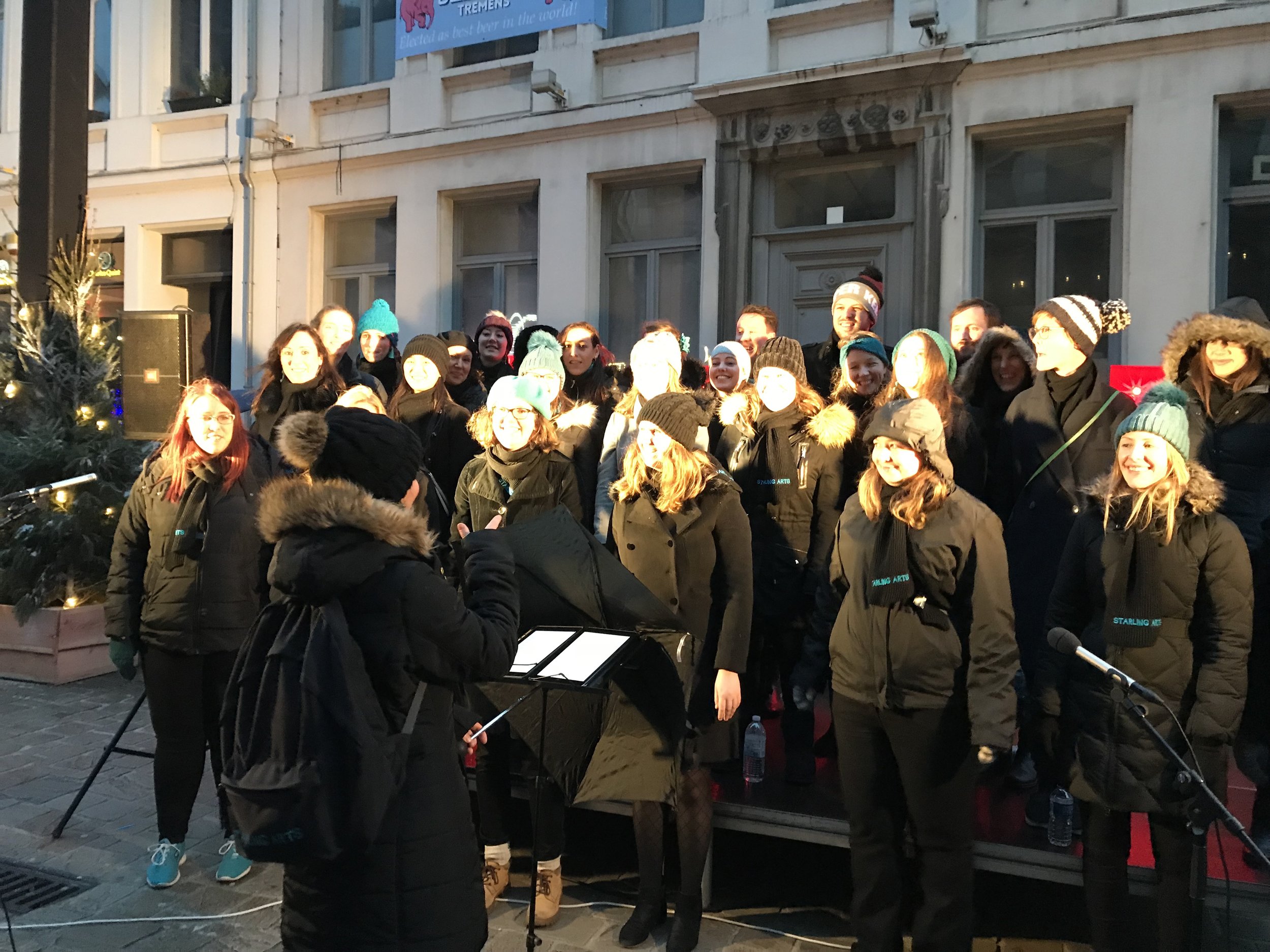 Singers from Starling Arts sing at the Winter Market in Ghent 