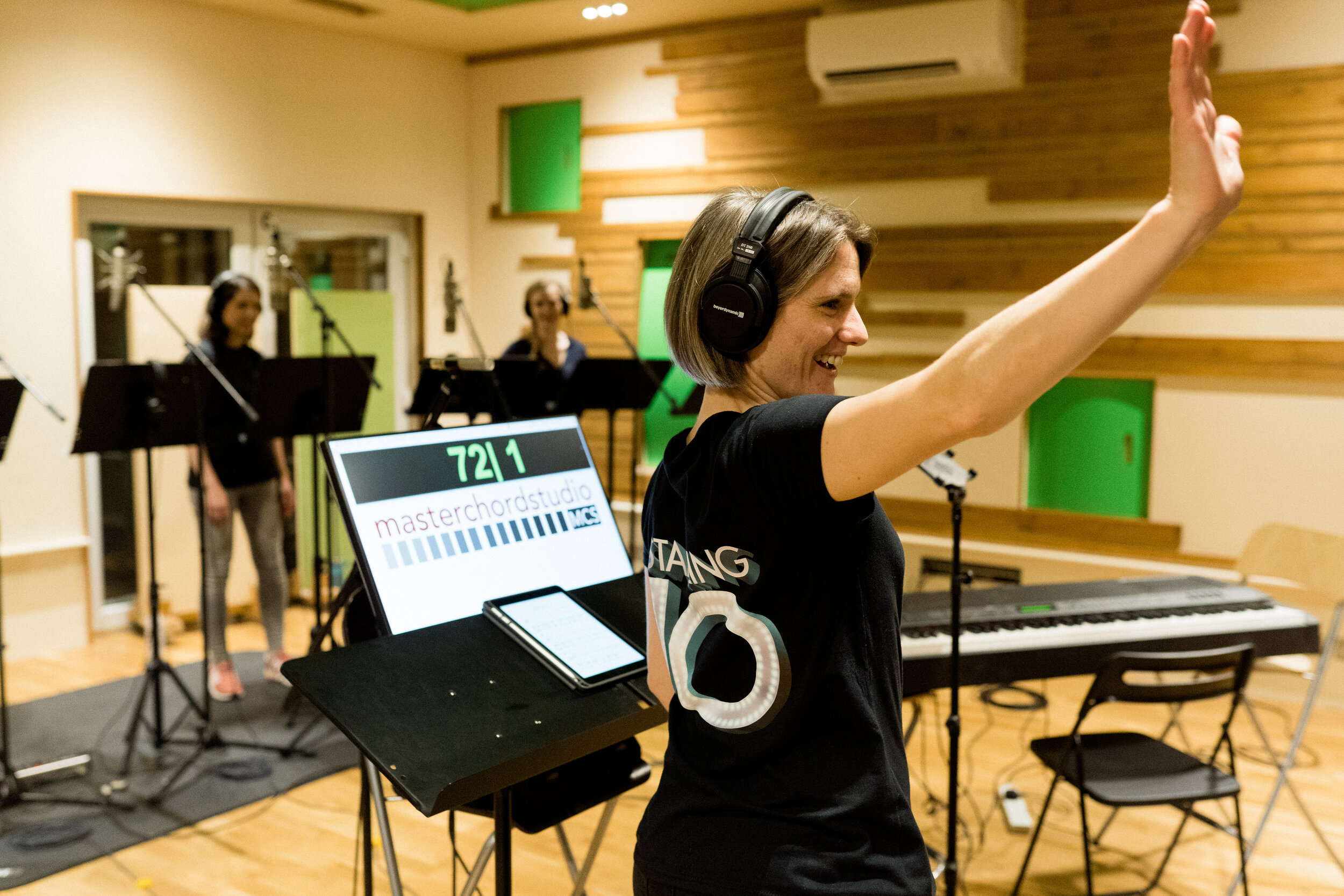 Expert singing leaders guide choirs in professional recording studio Photo by Florence Fox 