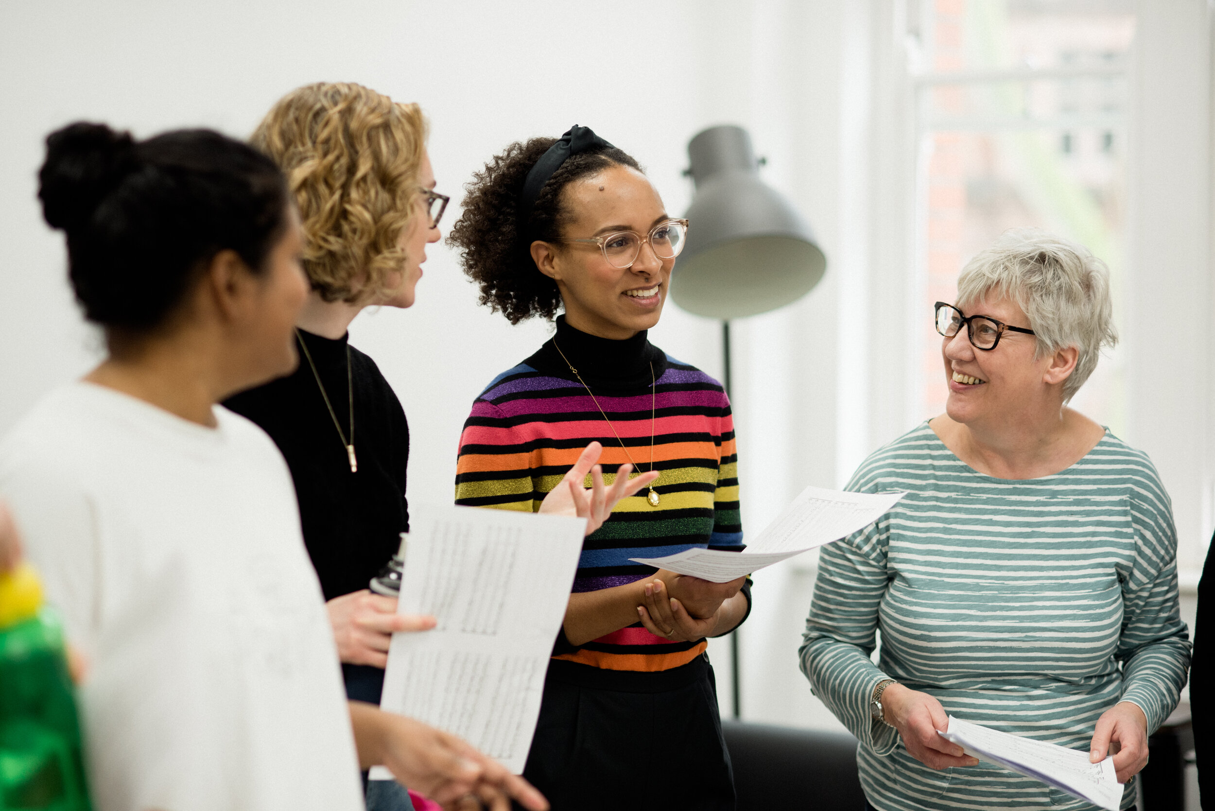 Choir members share a joke in rehearsal.jpg