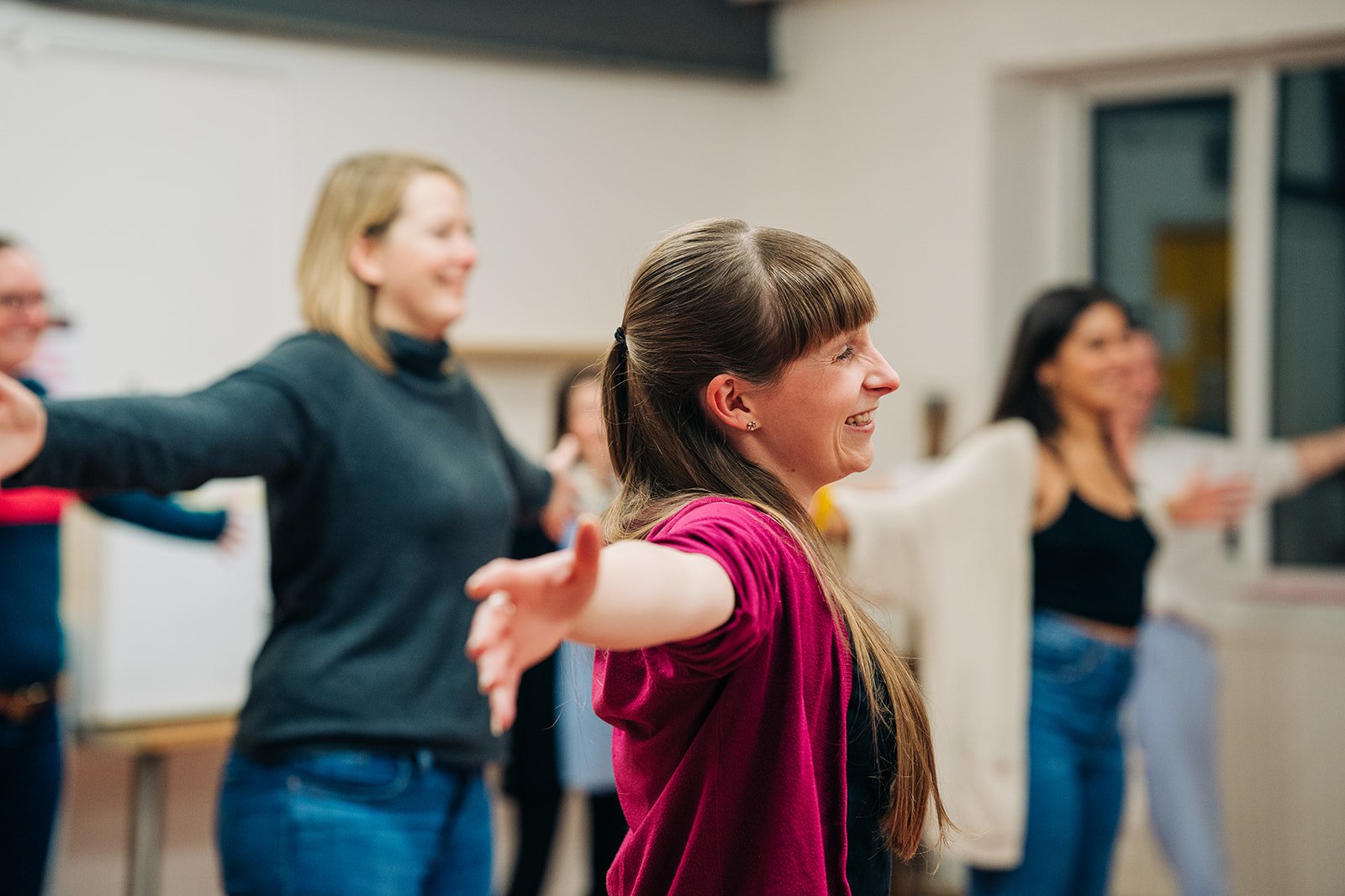 Starling Voices members enjoy a physical warmup