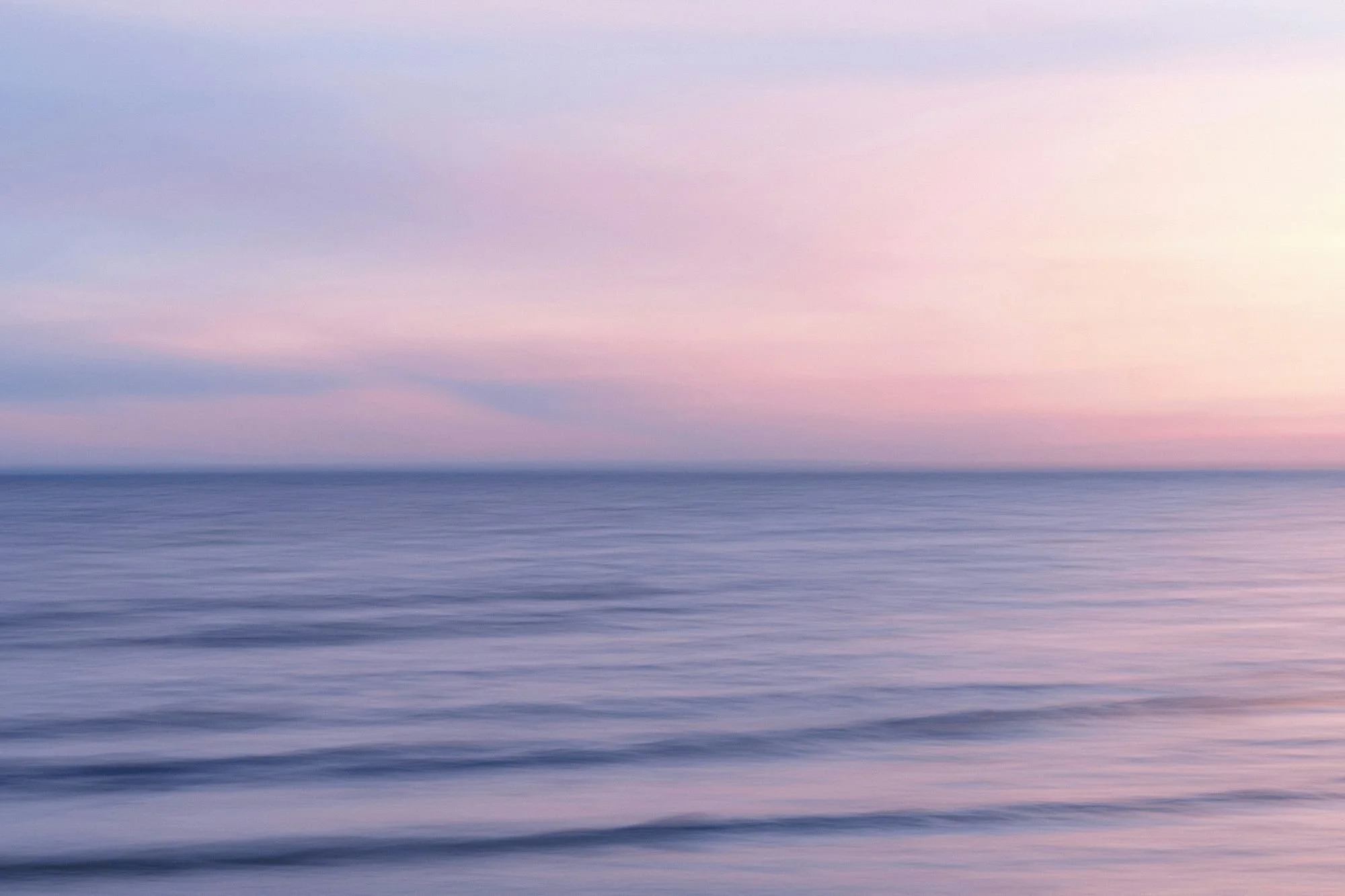 Calm ocean at sunset, evoking breathwork sessions for anxiety relief.