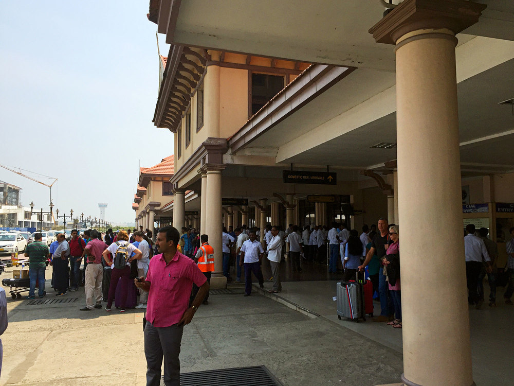 Outside the Kochi airport waiting for our driver, Rajesh, to bring the car.