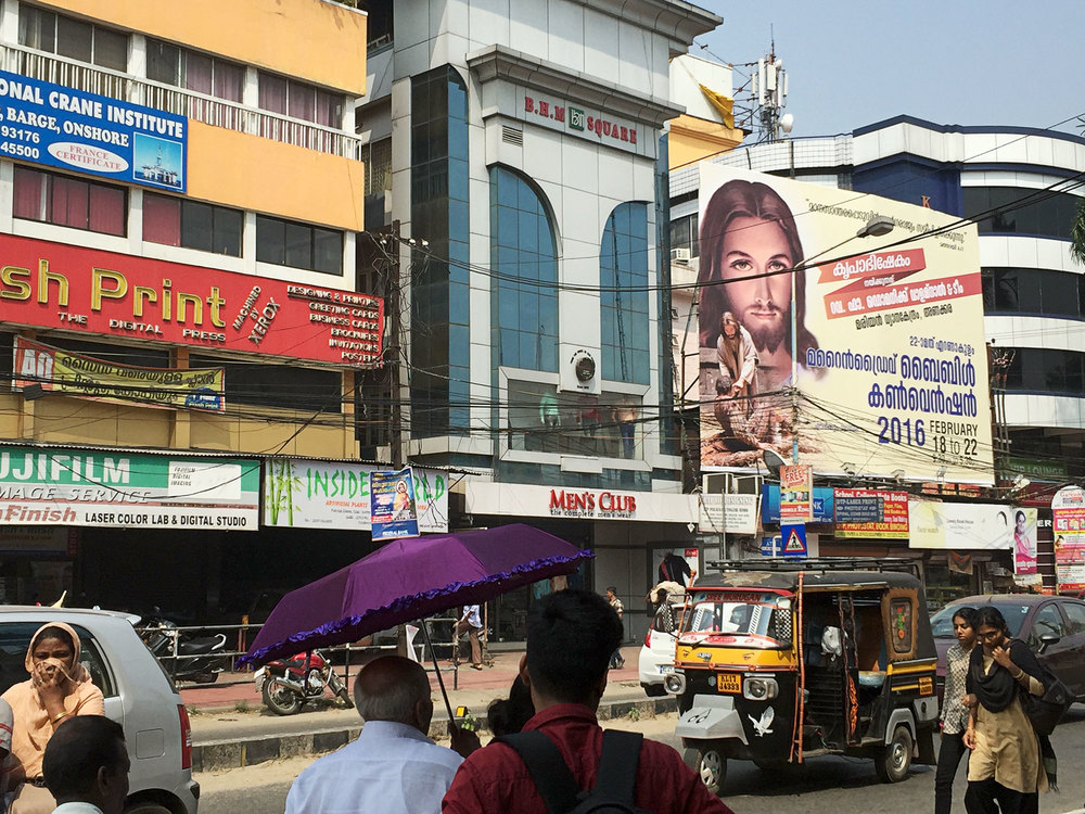 Downtown Kochi with Jesus billboard.