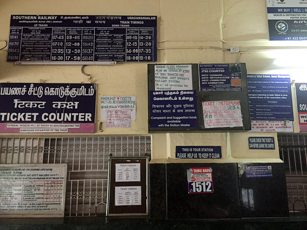 Train schedules inside the Ooty train station.  Confusing? Yes.