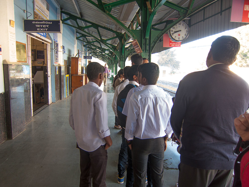 Some students waiting for their morning train to school.