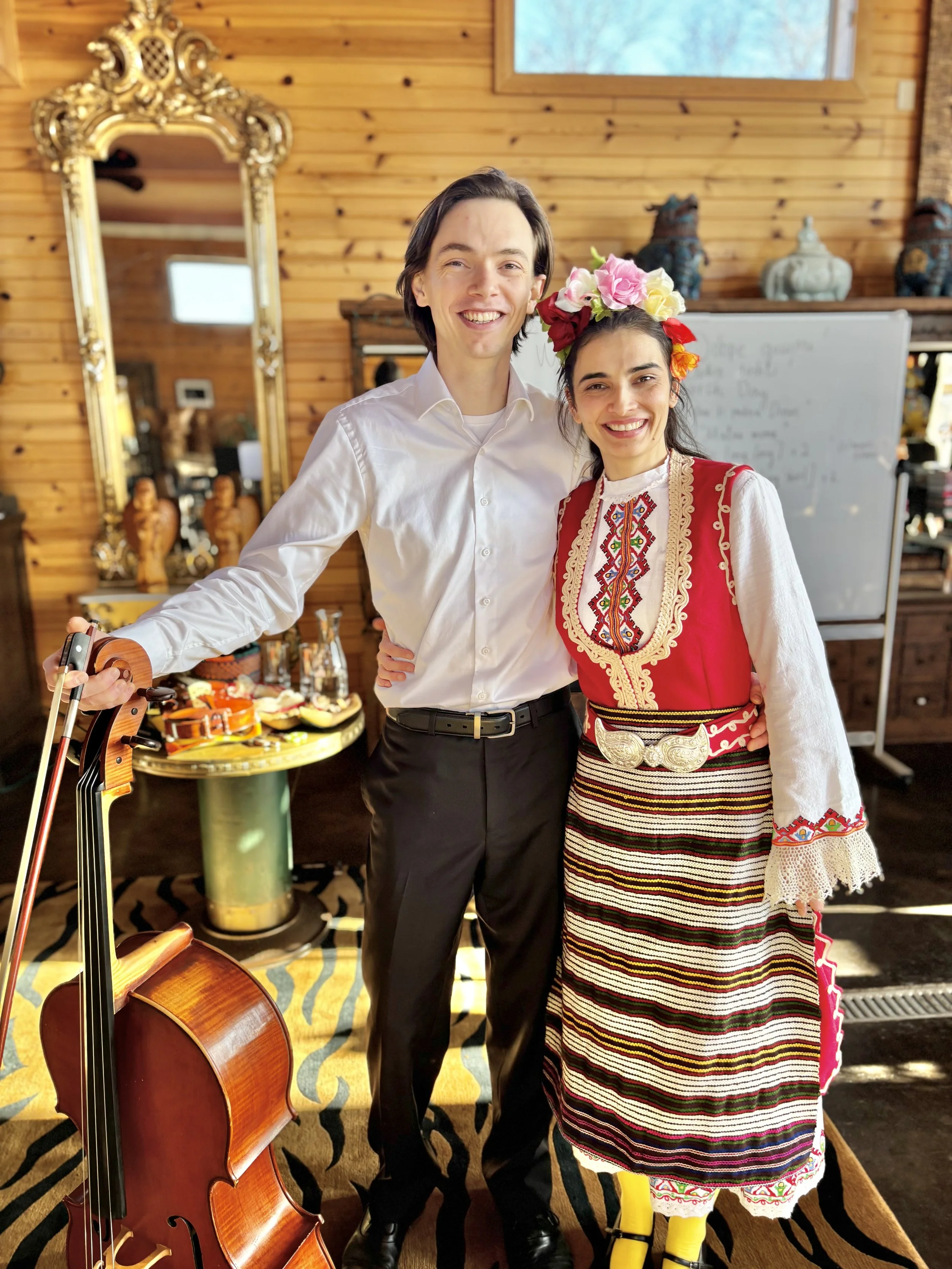 Two people smiling with their instruments