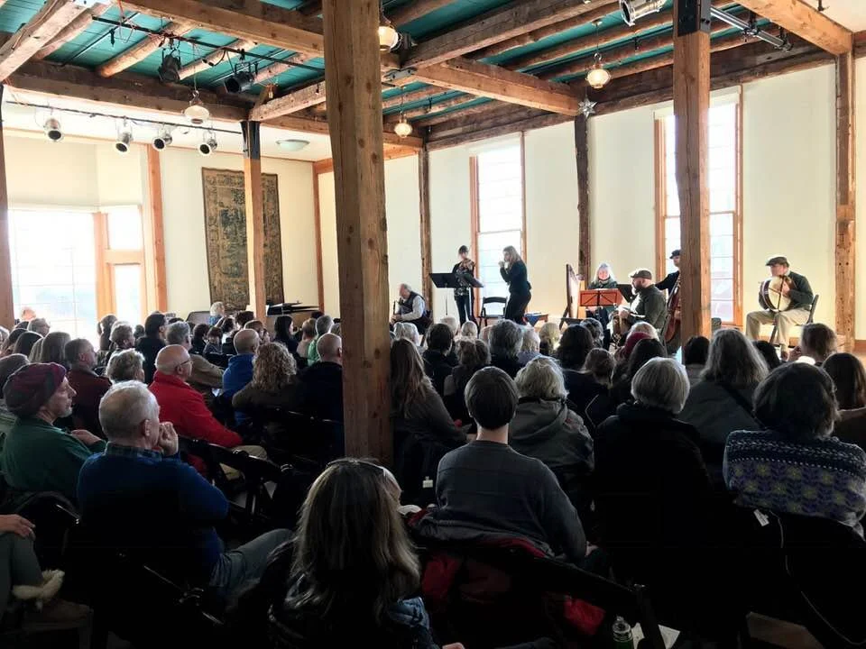 Musicians playing to a crowded audience