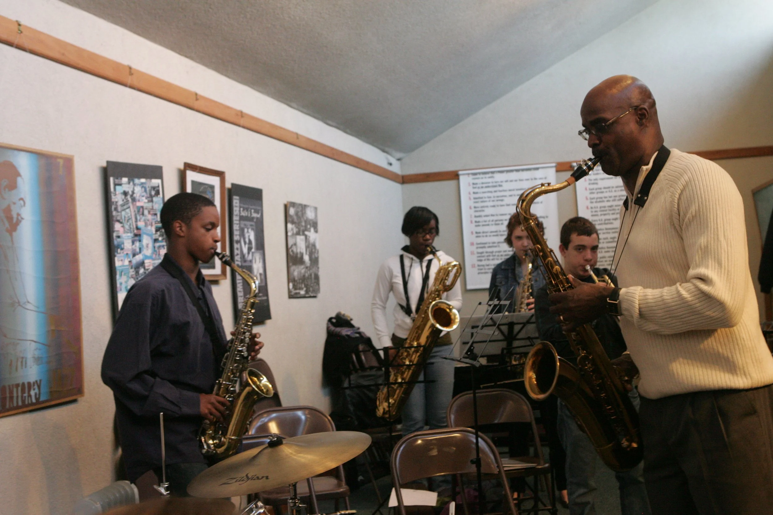 Group of people playing various wind instruments