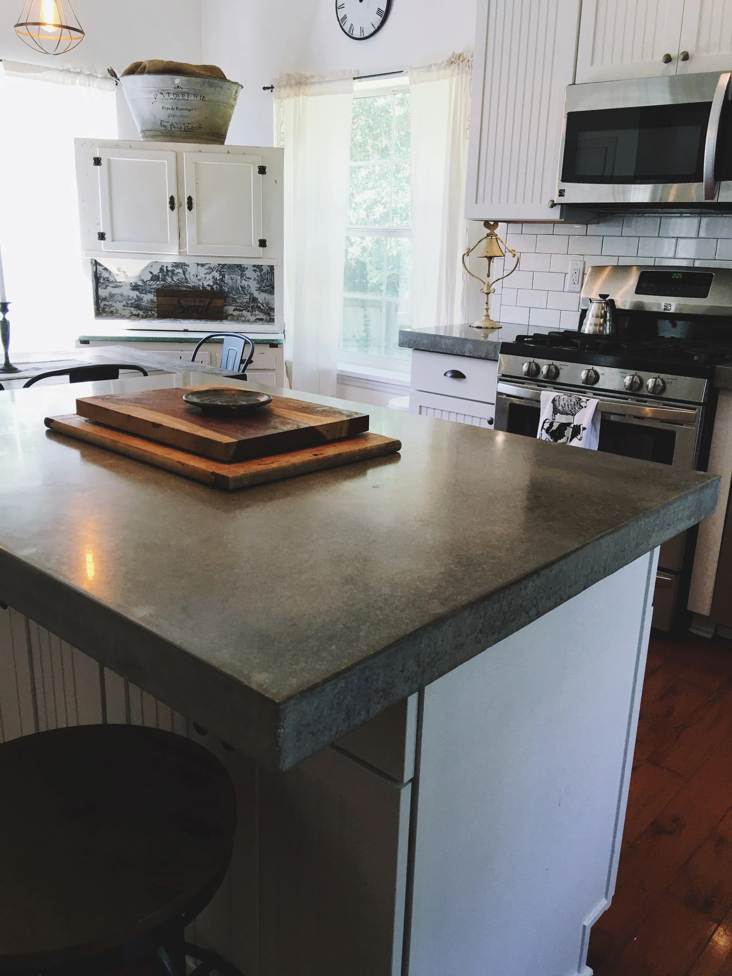 Farmhouse-style kitchen with custom concrete countertop 