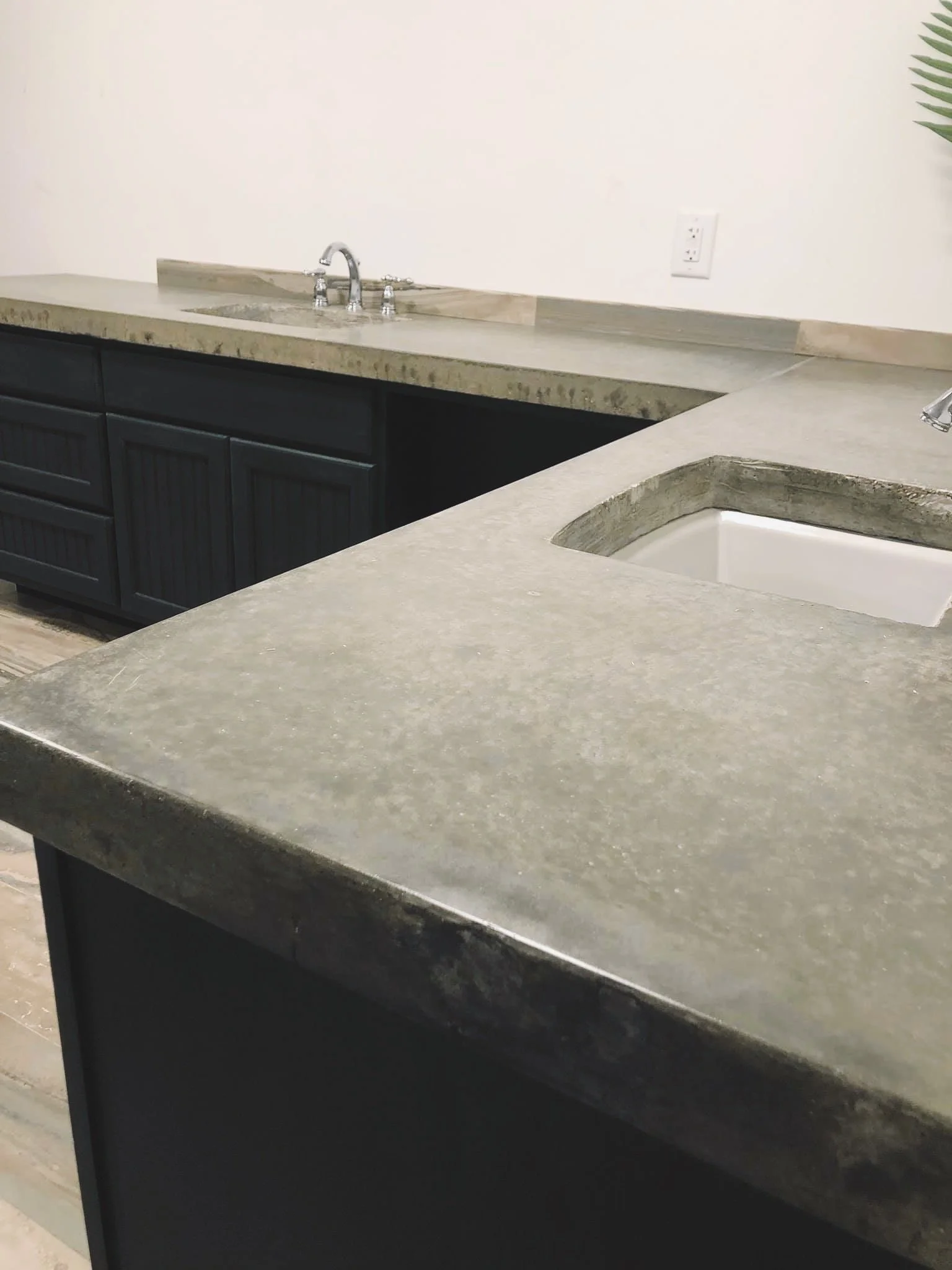 Custom bathroom renovation, concrete countertop dual drop in sinks. 