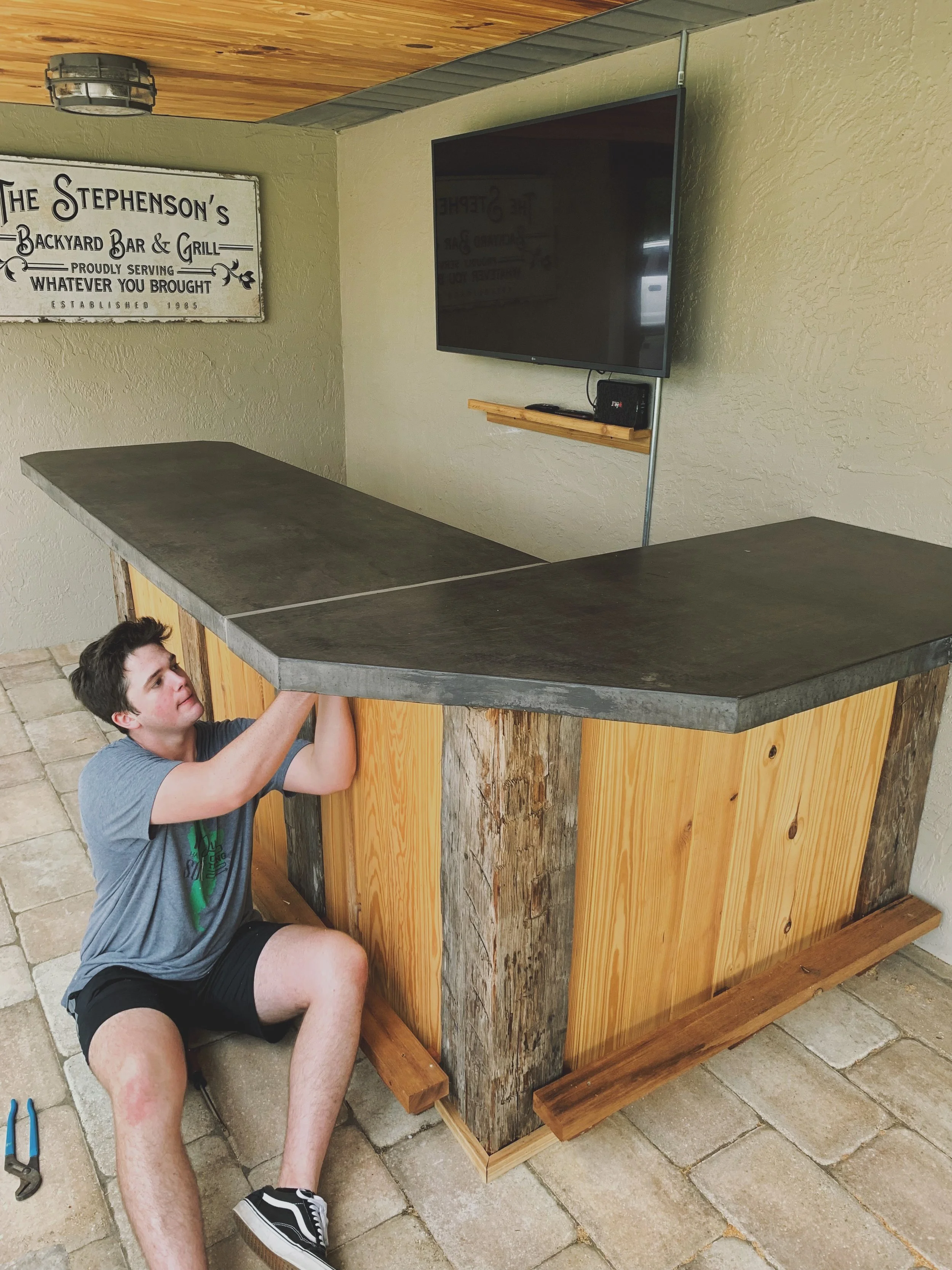 Custom outdoor kitchen, concrete countertop, outdoor bar. Custom installation