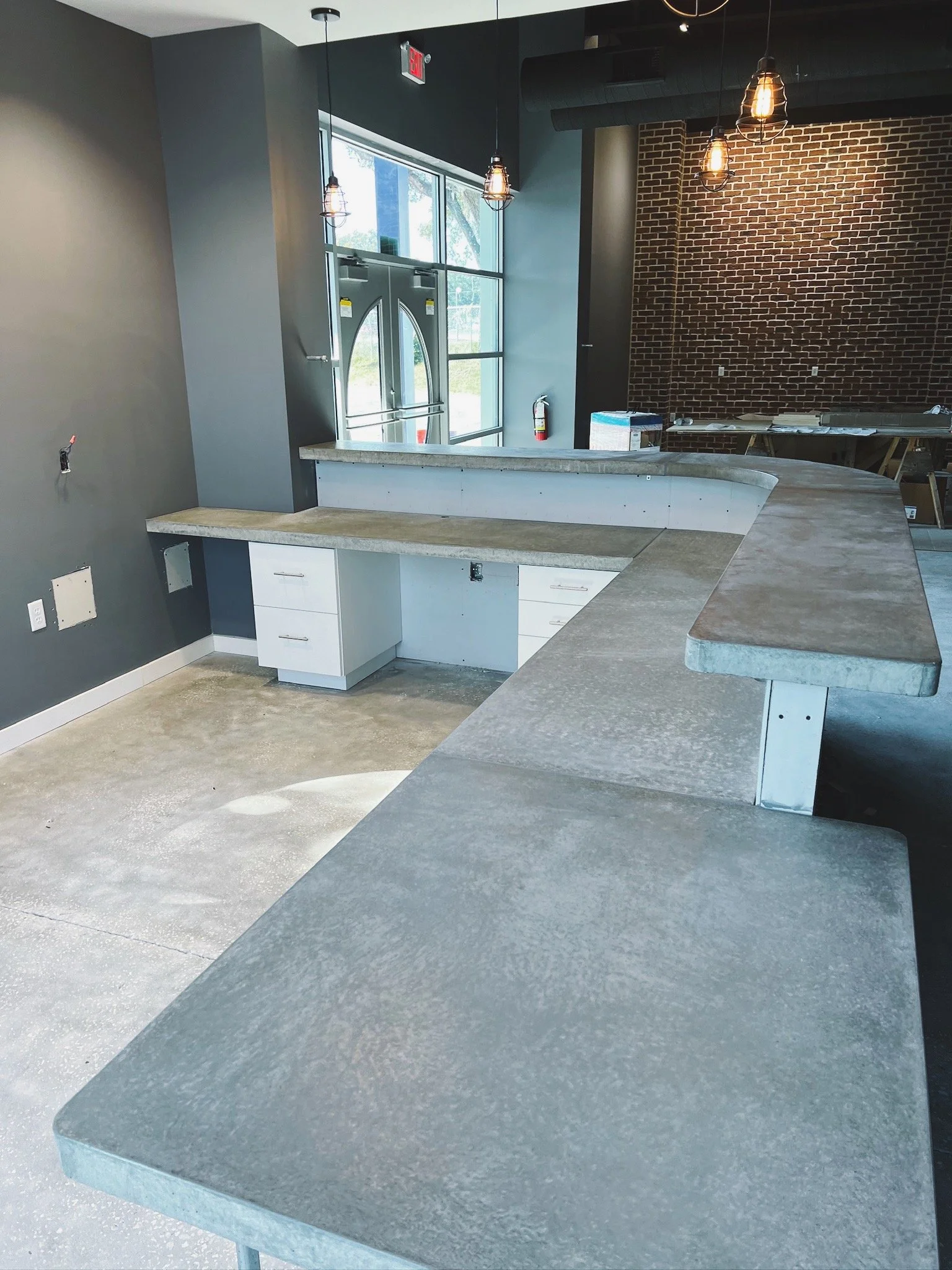 Bi-level custom concrete countertop for new construction.