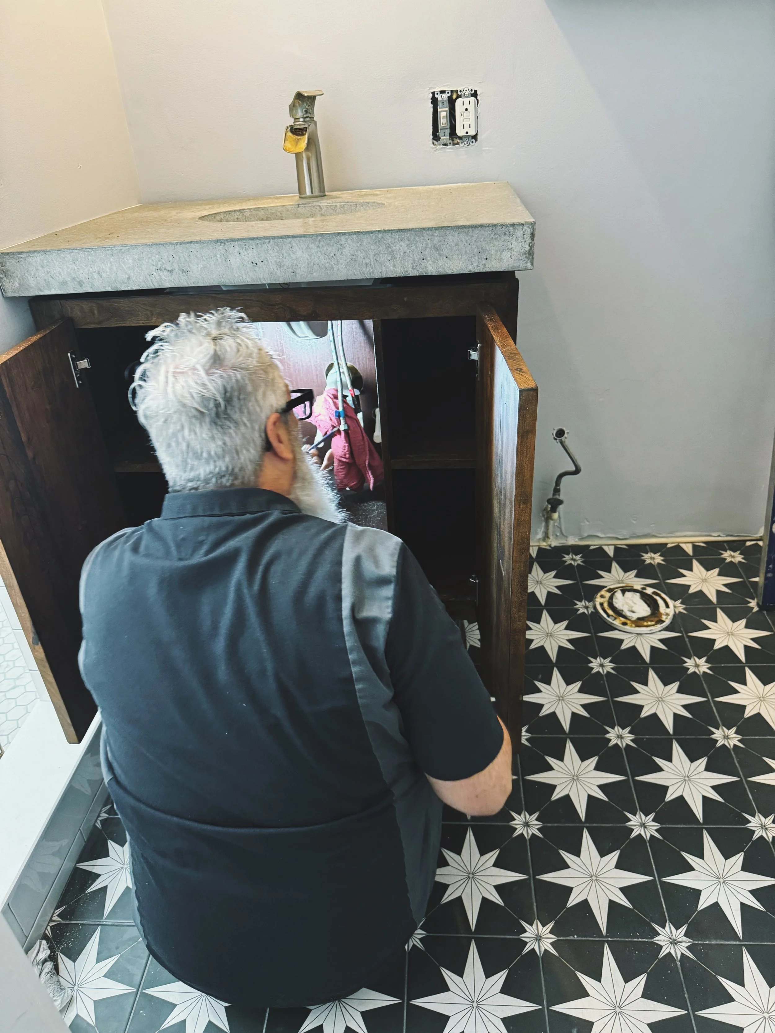 Custom bathroom renovation, concrete countertop, and cabinetry by Drake and Sons