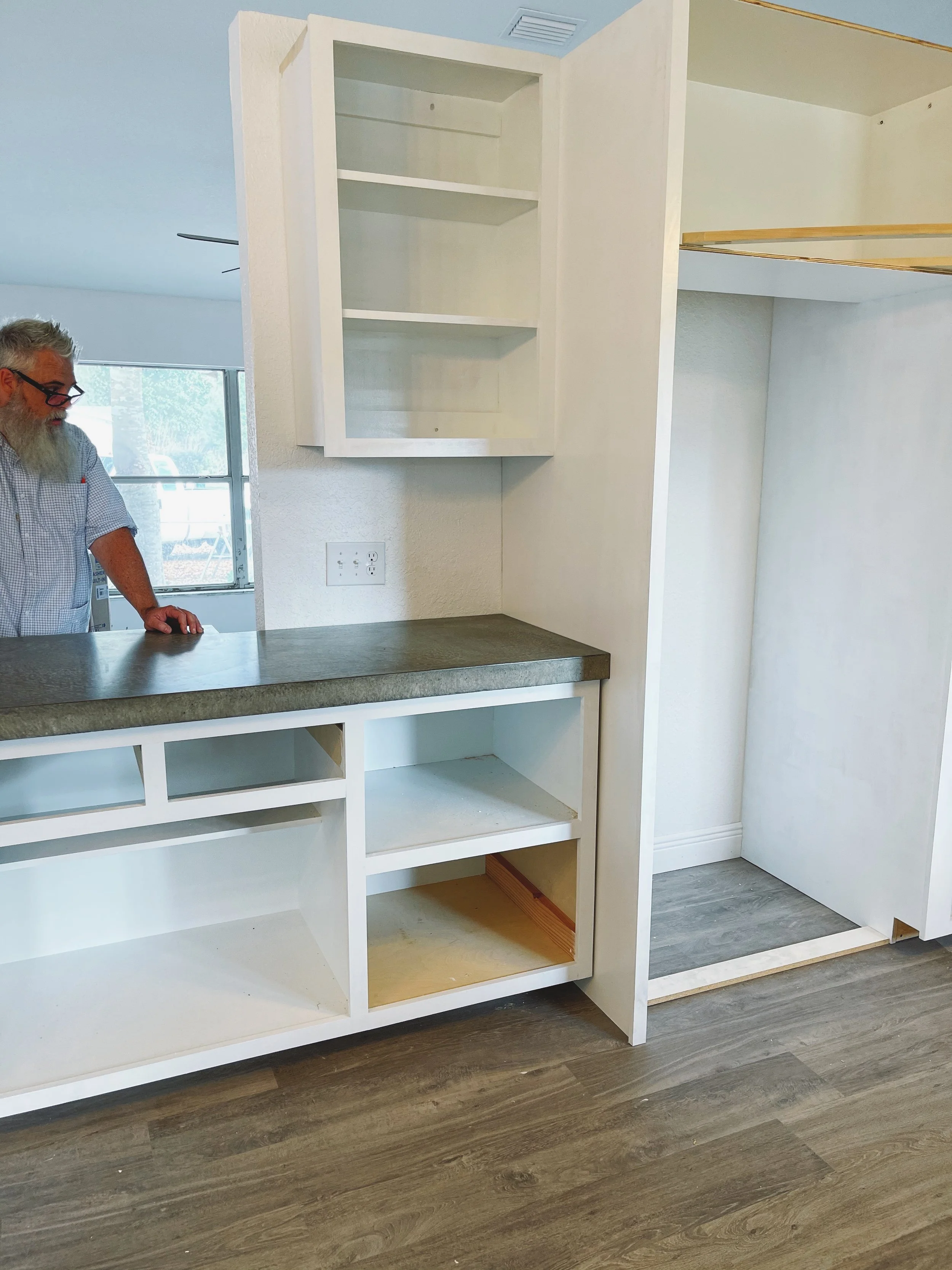 Beginning of complete kitchen renovation custom-built pantry and cabinets. Concrete countertops installation. 